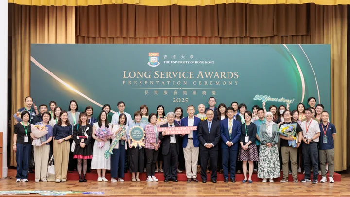 A group photo of HKU faculty and staff at the Long Service Awards Presentation Ceremony 2025 stage.
