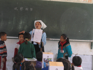 A Shui Ethnic Minority teacher teaching in school. 