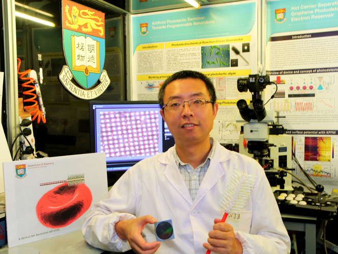 Dr Tang Jinyao showing the disc which contains millions of synthetic light-seeking nanorobots