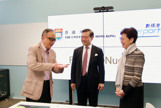Mr Hailson Yu (left), Deputy Director of HKU Technology Transfer Office, introduces the platform to the Chief Executive Mrs Carrie Lam and Chairman of Hong Kong Cyberport Management Company Limited Dr George Lam