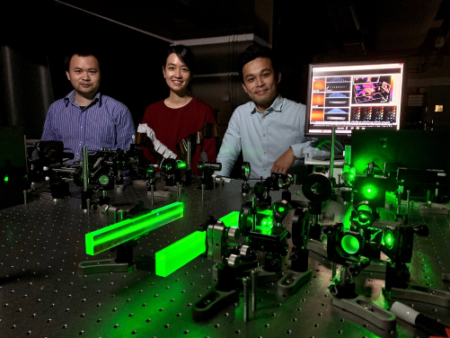 Dr Kevin Tsia (1st from right) and his team developed a new optical imaging technology to make 3D fluorescence microscopy more efficient and less damaging. (From left: Dr Yuxuan Ren, Dr Queenie Lai and Dr Kevin Tsia)