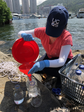 Katie Yeung collects a seawater sample from Aberdeen